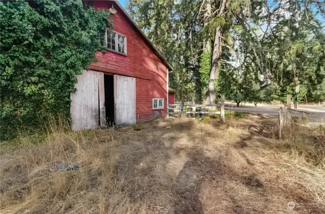 Barn with stalls and large hay loft or storage area.