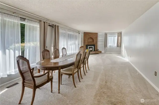 Large formal living and dining room area. Wall of windows brings in plenty of natural light.
