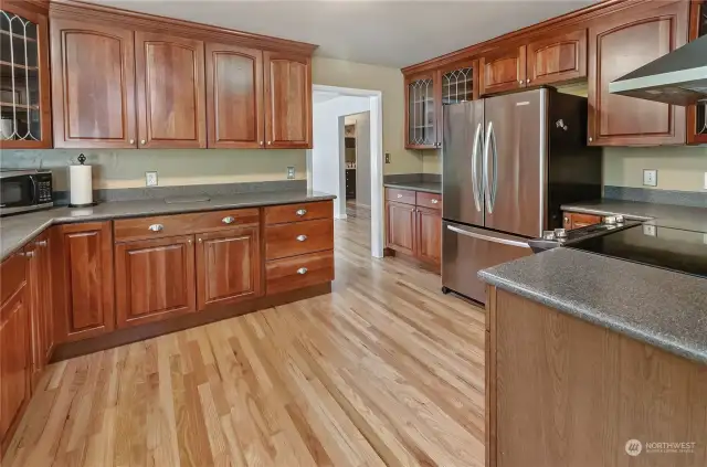 Gorgeous hardwood floors run throughout the kitchen, entry, hallway, and breakfast nook.