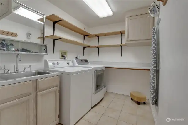 Laundry located on main floor next to garage access and across from the kitchen.