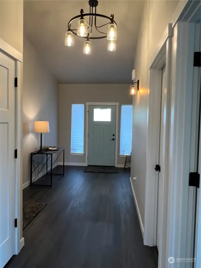 The entry hall is spacious, laundry closet is on your left, full bath is on your right and 2 bedroom is at front of the house