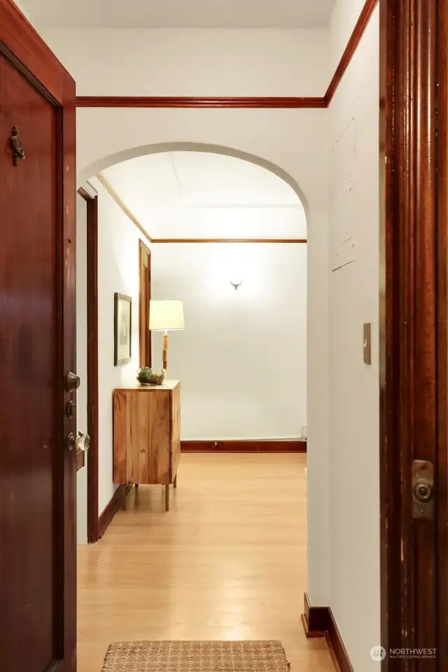 An arched entrance and refinished hardwood floors invite you inside this  wonderful main floor condominium