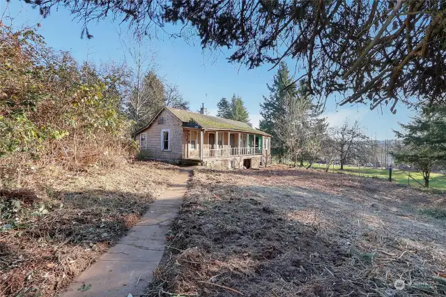 Follow the sidewalk from the driveway to the home