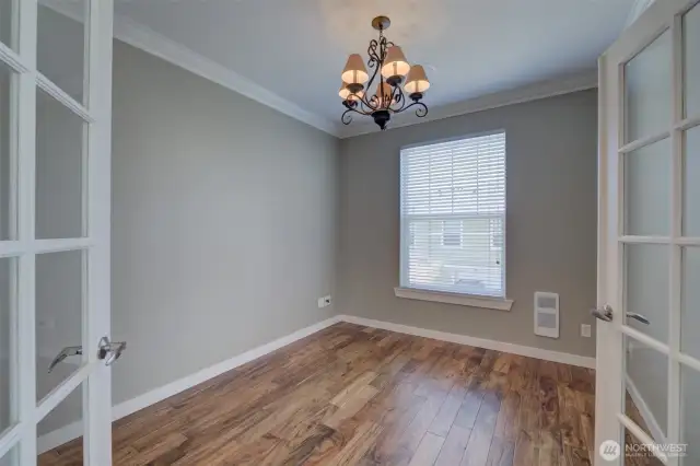 Elegant French doors to the versatile bedroom/office.