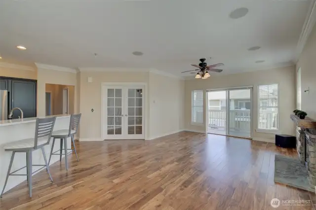 French doors open to a versatile bedroom/office.