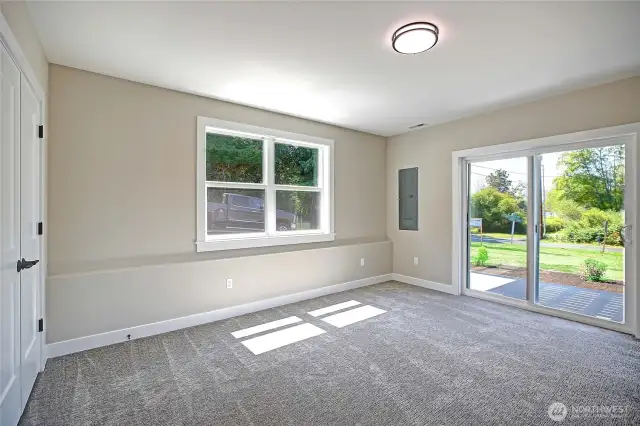Large bedroom with closet and access to covered patio