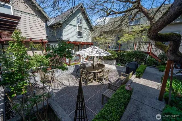 The community courtyard is a true garden oasis-great for relaxing, enjoying quiet moments outdoors, and bar-b-ques with friends and neighbors.
