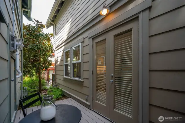 Private patio off of French doors. Both patios extend the main living space.
