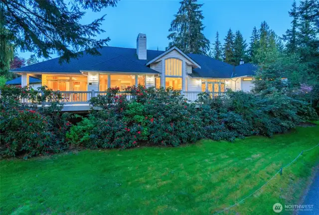 Expansive deck is perfectly positioned along the entire back side of the house and above the 15th green.