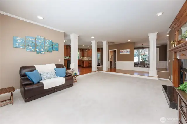 Oversized family room offers a double-sided gas fireplace.