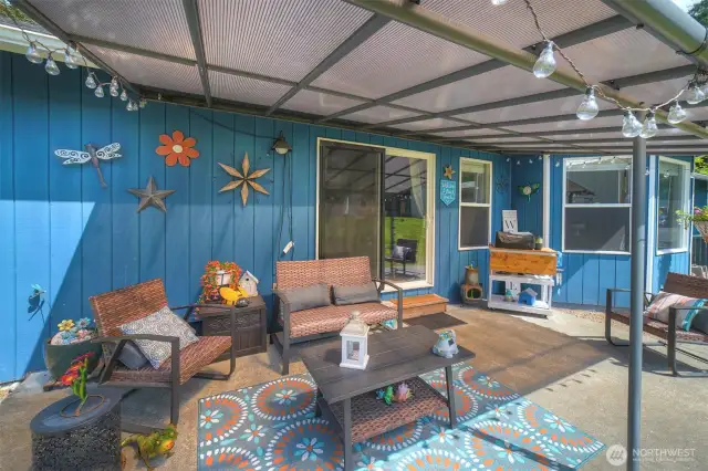 Covered back patio is perfect for the sun or the rain!