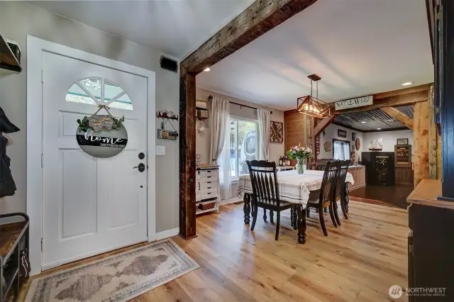 Beautiful wood beams accentuate the entrance and dining room.