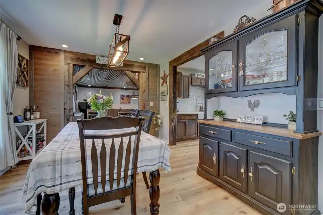 The dining room leads into the spacious bonus multi-purpose space and the kitchen to the right.