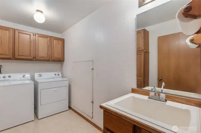 Spacious laundry room with utility sink. Washer and dryer are included!