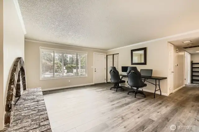 A large window in the living room lets in the natural light.