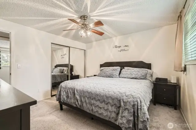 Another view of the primary bedroom which features a private bath.