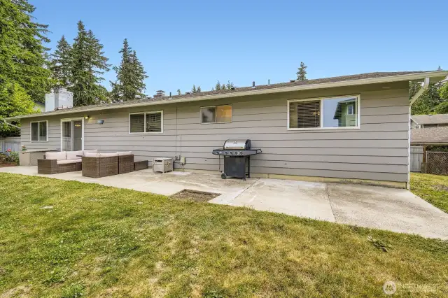 Back exterior with a large patio.