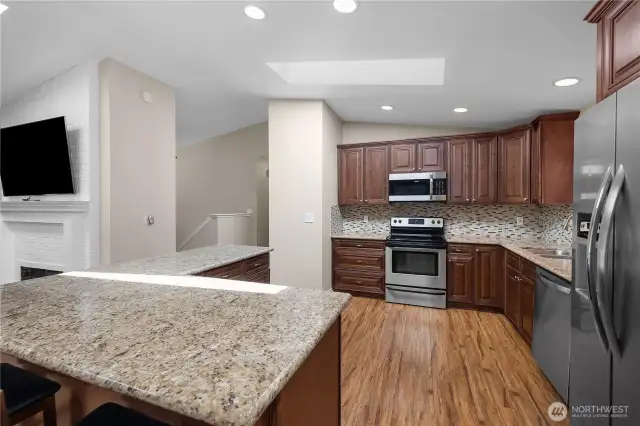 Stainless and stone kitchen.