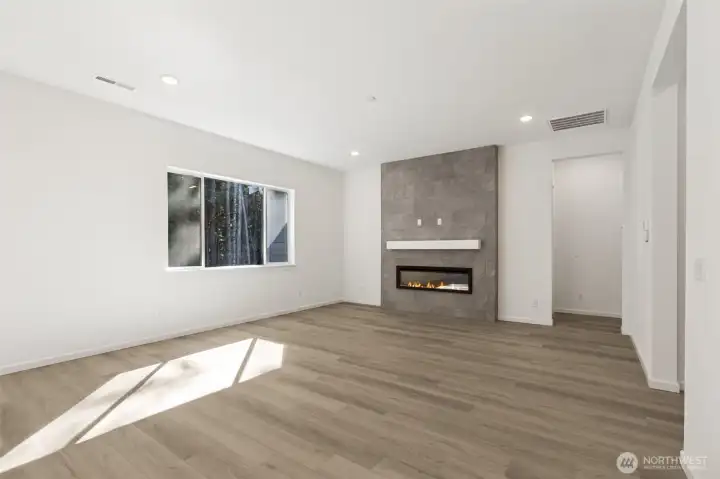 ***Actual Home *** Great room with cozy electric fireplace