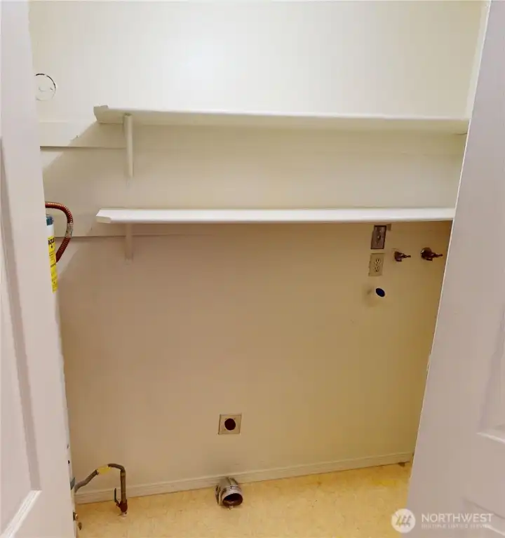 on the way to the upstairs is the "utility room" closet with washer dryer hook ups, the water heater is tucked away in here too