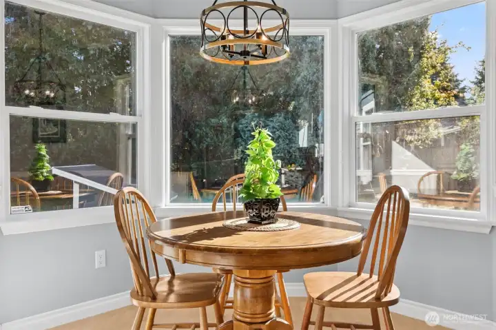 Dine in this kitchen with its natural light of these quaint bay windows