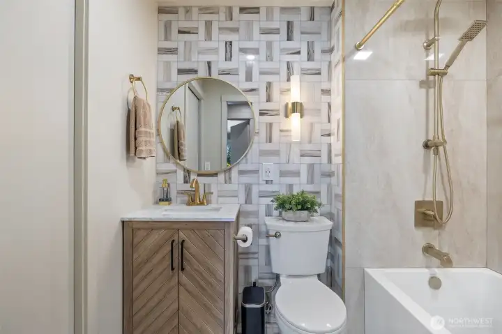 Main bath has had a full remodel with extensive tile work, new tub, lighting and vanity