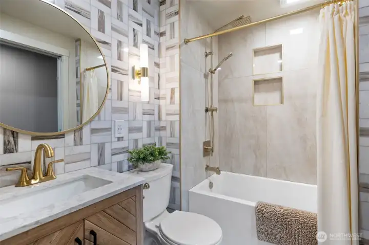 Main bath has had a full remodel with extensive tile work, new tub, lighting and vanity