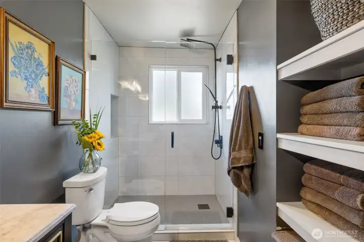 Primary bath walk-in shower with full height tile