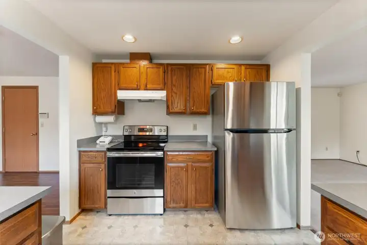 Updated kitchen featuring stainless steel appliances, abundant cabinet storage, and a practical layout for everyday cooking.