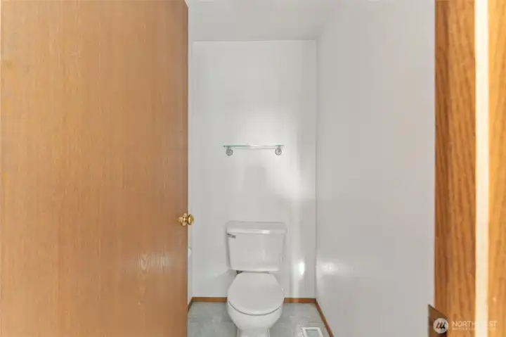 Convenient main-floor half bath with a simple and functional layout, perfect for guests.