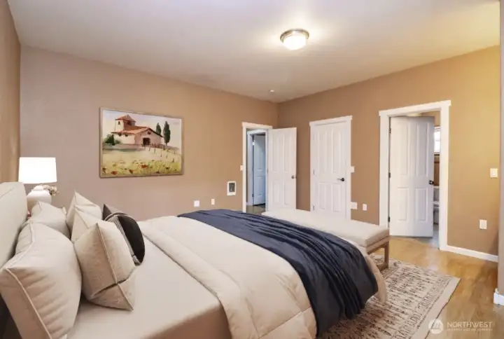 Primary bedroom w/ 3/4 bath, walk in closet and french doors to wrap around porch *virtually staged*