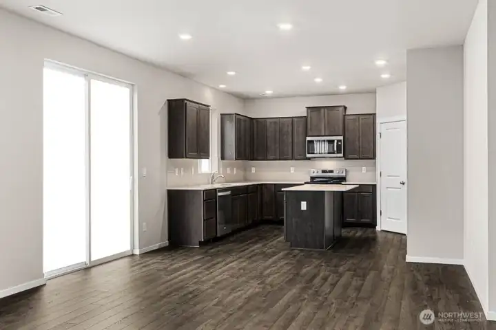 Kitchen features stainless steel appliances. Pictures are for representational purposes only, colors and features may vary.