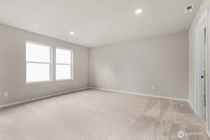 A lot of naturally lighting in the primary bedroom. Pictures are for representational purposes only, colors and features may vary.