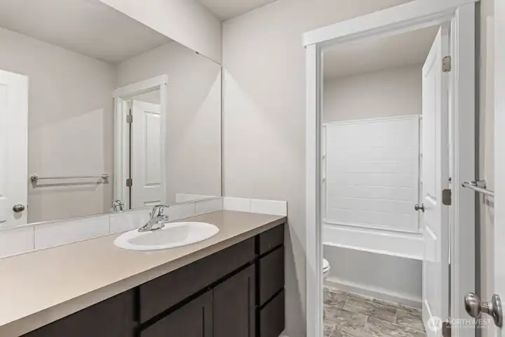 Secondary bathroom upstairs with nice seperation. Pictures are for representational purposes only, colors and features may vary.