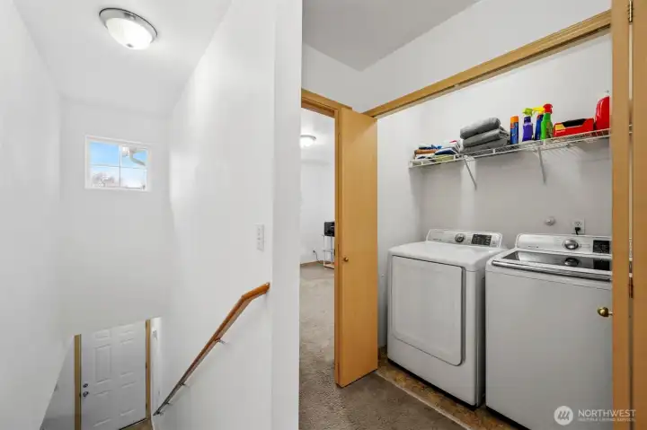 Upstairs laundry adds convenience. Laundry is set between the guest bedrooms.