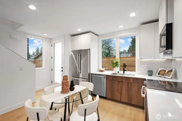 Abodian cabinets, quartz counters, SS appliances, and under-cabinet lighting.