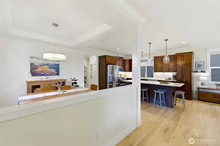 Open-concept main floor flows seamlessly from formal dining to the chef's kitchen — entertainer's dream layout. Open-concept main floor flows seamlessly from formal dining to the chef's kitchen — entertainer's dream layout.