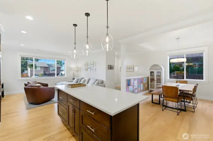Open-concept main floor flows seamlessly from chef's kitchen to dining and living — coffered tray ceilings and entertainer-ready layout. Open-concept main floor flows seamlessly from chef's kitchen to dining and living — coffered tray ceilings and entertainer-ready layout.