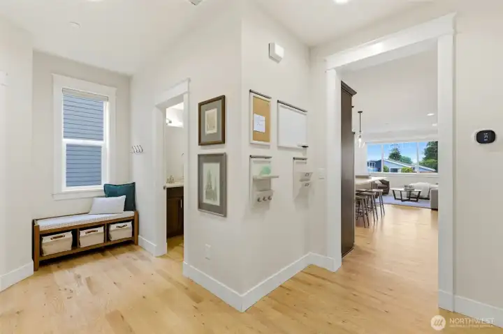 Mudroom drop zone with built-in bench, hooks, and family command center — smart everyday function. Mudroom drop zone with built-in bench, hooks, and family command center — smart everyday function.