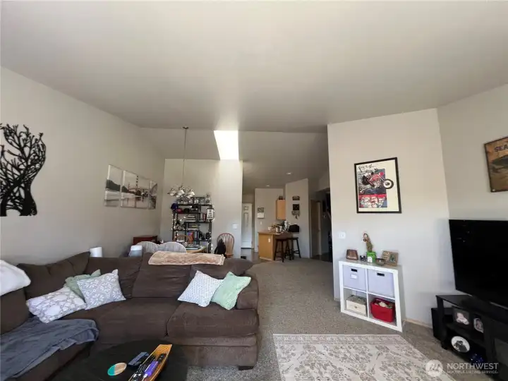 Living Room w Vaulted Ceilings to Open Kitchen w Eating Bar