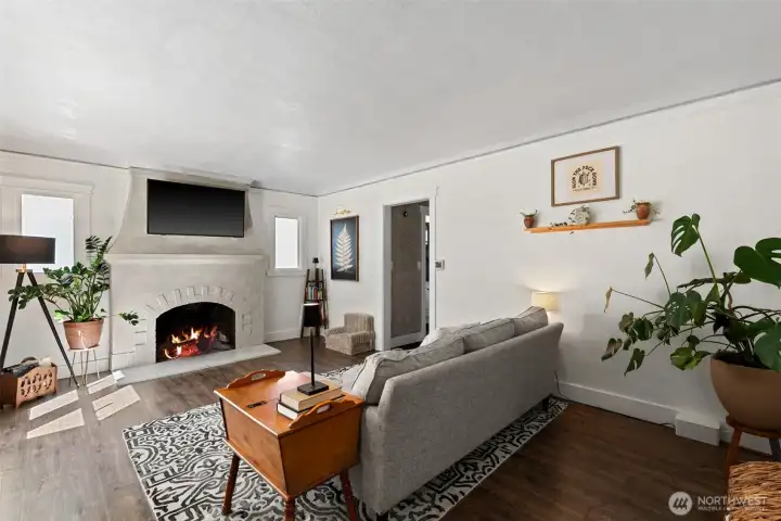 Warm wood floors.. cozy, historically pleasing fireplace.