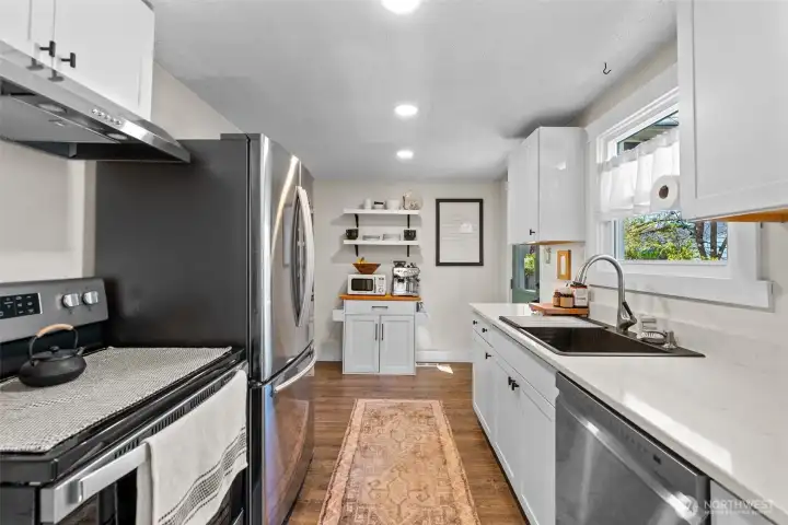 Kitchen looking from dining arch. Quality appliances, deep large sink : )