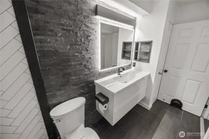 tiled walls and flooring, upgraded ceramic sink, faucets and other hardware