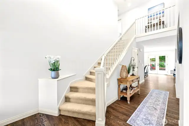 Cathedral ceilings bring light and easy access to upstairs-Notice the Wide hallways too!