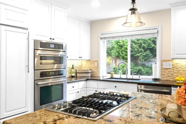 Cabinet faced fridge, microwave/oven will please any chef!