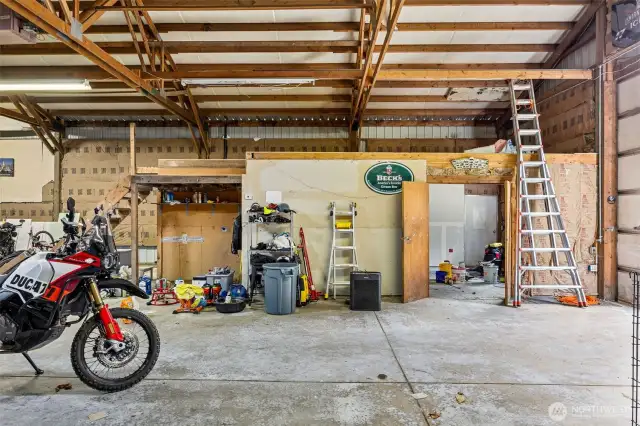 Taking a look at the loft storage space above the office. Close the office doors to the shop and there is a separate entrance to the office space and bathroom that is plumbed for a 3/4 bath. There are also washer and dryer hook ups. Perfect if you are seeking to run a business out of the shop.