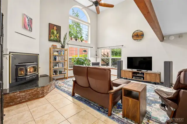 Enter into the living room with vaulted ceilings and tons of natural light. Stay cozy next to the wood fireplace on those chilly nights.