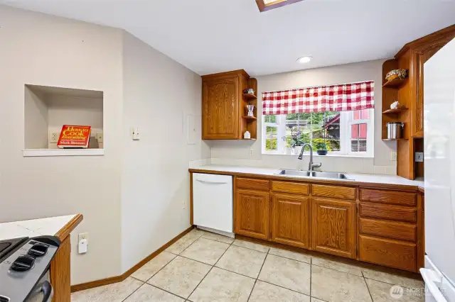 Kitchen overlooks the backyard.