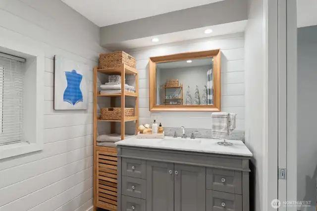 This beautiful bath offers marble countertops and designer touches.