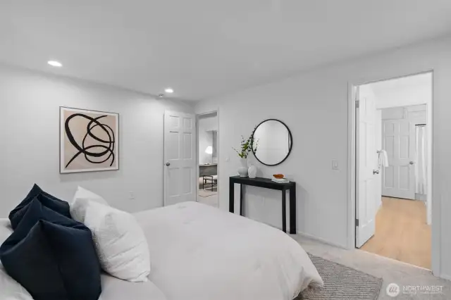 Primary bedroom with a beautifully updated en suite bath.